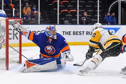 May 26, 2021; Uniondale, New York, USA; Pittsburgh Penguins left wing Sam Miletic (42) attempts a move around New York Islanders goaltender Ilya Sorokin (30) during the first period in game six of the first round of the 2021 Stanley Cup Playoffs at Nassau Veterans Memorial Coliseum. Mandatory Credit: Dennis Schneidler-USA TODAY Sports