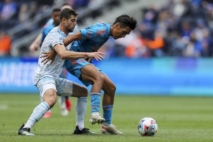 May 29, 2021; Cincinnati, OH, USA; New England Revolution midfielder Matt Polster (8) battles for the ball against FC Cincinnati forward Yuya Kubo (7) in the first half at TQL Stadium. Mandatory Credit: Katie Stratman-USA TODAY Sports