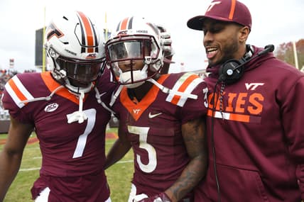 Nov 18, 2017; Blacksburg, VA, USA; Virginia Tech Hokies defensive back Devon Hunter (7) and cornerback Greg Stroman (3) and assistant coach Zohn Burden celebrate after the game. The Hokies defeated the Panthers 20-14 at Lane Stadium. Mandatory Credit: Bob Donnan-USA TODAY Sports