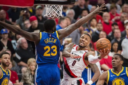 May 20, 2019; Portland, OR, USA; Portland Trail Blazers guard Damian Lillard (0) puts up a shot against Golden State Warriors forward Draymond Green (23) during the second half in game four of the Western conference finals of the 2019 NBA Playoffs at Moda Center. The Warriors won 119-117 in overtime. Mandatory Credit: Troy Wayrynen-USA TODAY Sports
