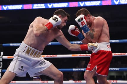 Dec 19, 2020; San Antonio, TX, USA;   Canelo Alvarez (red trunks) and Callum Smith (white trunks) during their WBA, WBC and Ring Magazine super middleweight championship bout at the Alamodome in San Antonio, TX. Mandatory Credit: Ed Mulholland/Handout Photo via USA TODAY Sports