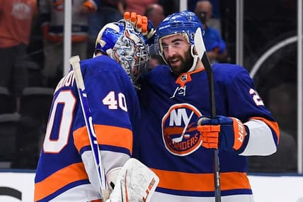 Jun 5, 2021; Uniondale, New York, USA; New York Islanders right wing Kyle Palmieri (21) celebrates with goaltender Semyon Varlamov (40) after defeating the Boston Bruins in game four of the second round of the 2021 Stanley Cup Playoffs at Nassau Veterans Memorial Coliseum. Mandatory Credit: Dennis Schneidler-USA TODAY Sports