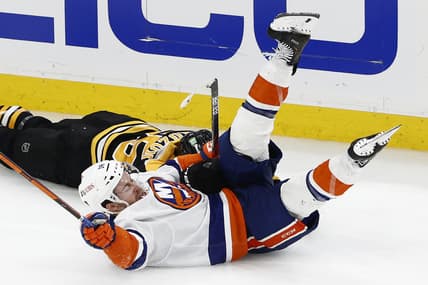 Jun 7, 2021; Boston, Massachusetts, USA; New York Islanders left wing Anthony Beauvillier (18) goes down after colliding with Boston Bruins defenseman Jeremy Lauzon (55) during the third period of game five of the second round of the 2021 Stanley Cup Playoffs at TD Garden. Mandatory Credit: Winslow Townson-USA TODAY Sports