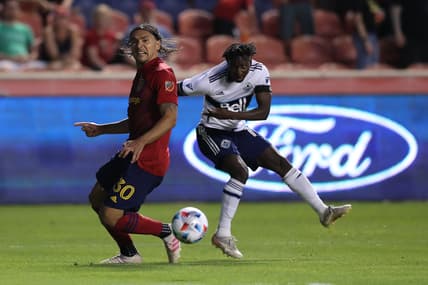 Jun 18, 2021; Sandy, Utah, USA; Real Salt Lake defender Marcelo Silva (30) defends a shot by Vancouver Whitecaps midfielder Janio Bikel (19) in the second half at Rio Tinto Stadium. Mandatory Credit: Rob Gray-USA TODAY Sports