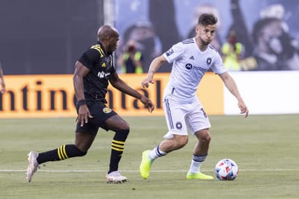 Jun 19, 2021; Columbus, Ohio, USA; Columbus Crew midfielder Darlington Nagbe (6) pressures Chicago Fire midfielder Alvaro Medran (10) during the first half of the final game at Historic Crew Stadium. Mandatory Credit: Greg Bartram-USA TODAY Sports