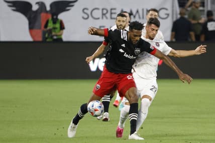 Jun 19, 2021; Washington, DC, Washington, DC, USA; D.C. United defender Donovan Pines (23) dribbles the ball as Inter Miami forward Julian Carranza (21) defends in the first half at Audi Field. Mandatory Credit: Geoff Burke-USA TODAY Sports