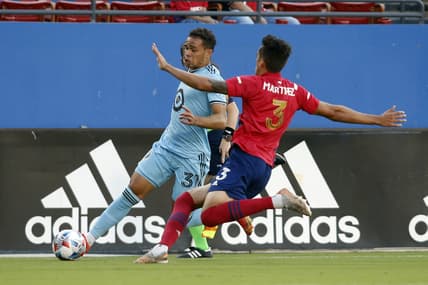 Jun 19, 2021; Frisco, Texas, USA;  Minnesota United midfielder Hassani Dotson (31) controls the ball against FC Dallas defender Jose Antonio Martinez (3) during the first half at Pizza Hut Park. Mandatory Credit: Tim Heitman-USA TODAY Sports