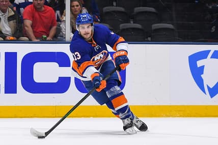 Jun 19, 2021; Uniondale, New York, USA; New York Islanders center Mathew Barzal (13) attempts a pass against the Tampa Bay Lightning during the second period in game four of the 2021 Stanley Cup Semifinals at Nassau Veterans Memorial Coliseum. Mandatory Credit: Dennis Schneidler-USA TODAY Sports