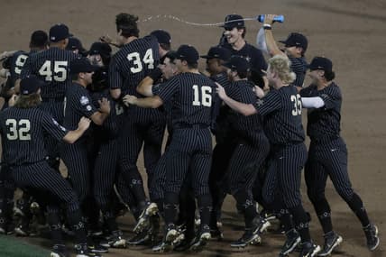 Jun 19, 2021; Omaha, Nebraska, USA;  Vanderbilt Commodores third baseman Jayson Gonzalez (99) celebrates after defeating the Arizona Wildcats  at TD Ameritrade Park. Mandatory Credit: Bruce Thorson-USA TODAY Sports