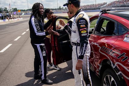 New Orleans Saints running back Alvin Kamara greets NASCAR Cup Series driver Aric Almirola before the NASCAR Cup Series Ally 400 race at the Nashville Superspeedway in Lebanon, Tenn., Sunday, June 20, 2021.

Ally400 062021 An 002