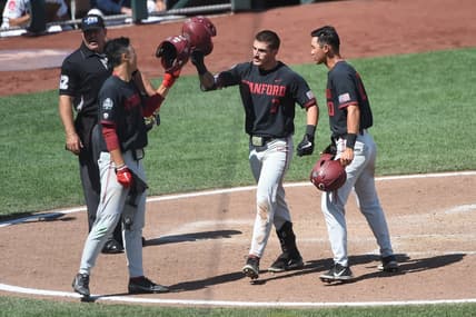 Jun 21, 2021; Omaha, Nebraska, USA;  Stanford Cardinal outfielder Brock Jones (7) celebrates a home run with outfielder Eddie Park (14) and infielder Adam Crampton (10) against the Arizona Wildcats in the seventh inning at TD Ameritrade Park. Mandatory Credit: Steven Branscombe-USA TODAY Sports