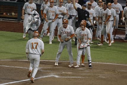 Jun 25, 2021; Omaha, Nebraska, USA;  Texas Longhorns designated hitter Ivan Melendez (17) scores after hitting a three-run home run against the Mississippi State Bulldogs at TD Ameritrade Park. Mandatory Credit: Bruce Thorson-USA TODAY Sports