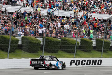 Jun 26, 2021; Long Pond, PA, USA; NASCAR Camping World Truck Series driver John Hunter Nemechek (4) celebrates after winning the CRC Brakleen 150 at Pocono Raceway. Mandatory Credit: Matthew OHaren-USA TODAY Sports