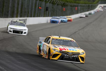 Jun 26, 2021; Long Pond, Pennsylvania, USA; NASCAR Cup Series driver Kyle Busch (18) leads driver William Byron (24) during the Pocono Organics CBD 325 at Pocono Raceway. Mandatory Credit: Matthew OHaren-USA TODAY Sports