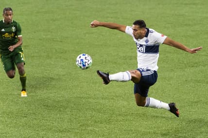 Nov 1, 2020; Portland, Oregon, USA; Vancouver Whitecaps defender Ali Adnan (53) kicks the ball during the first half against the Portland Timbers at Providence Park. Mandatory Credit: Troy Wayrynen-USA TODAY Sports