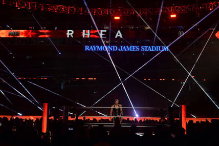 Apr 11, 2021; Tampa, Florida, USA; Asuka (green/yellow attire) and Rhea Ripley (black attire) during the Raw Women's Championship match at WrestleMania 37 at Raymond James Stadium. Mandatory Credit: Joe Camporeale-USA TODAY Sports