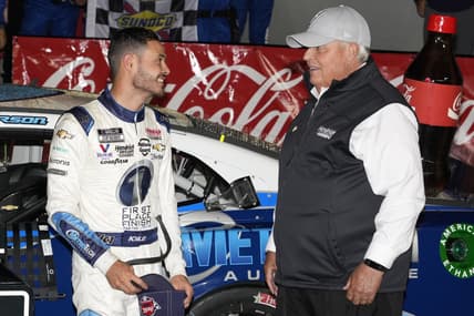 May 30, 2021; Concord, North Carolina, USA;  NASCAR Cup Series driver Kyle Larson (5) talks with team owner Rick Hendrick on his winning the Coca-Cola 600 at Charlotte Motor Speedway. Mandatory Credit: Jim Dedmon-USA TODAY Sports