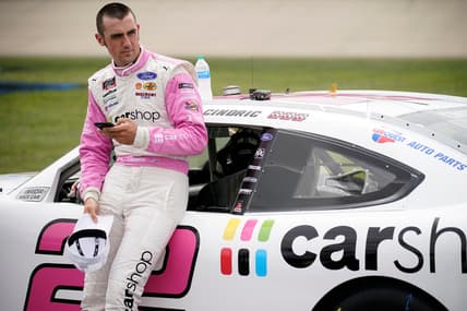 NASCAR Xfinity Series driver Austin Cindric (22) checks his phone prior to the Tennessee Lottery 250 NASCAR Xfinity Series race at the Nashville Superspeedway in Lebanon, Tenn., Saturday, June 19, 2021.

Nascar X 002
