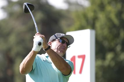 Jul 1, 2021; Detroit, Michigan, USA; Phil Mickelson tees off on the 17th hole during the first round of the Rocket Mortgage Classic golf tournament. Mandatory Credit: Raj Mehta-USA TODAY Sports
