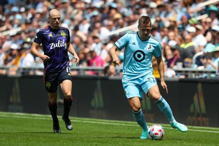 Jul 18, 2021; Saint Paul, MN, Saint Paul, MN, USA; Minnesota United midfielder Robin Lod (17) dribbles the ball while Seattle Sounders defender Brad Smith (11) defends in the first half at Allianz Field. Mandatory Credit: David Berding-USA TODAY Sports