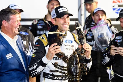 Jul 18, 2021; Loudon, New Hampshire, USA; NASCAR Cup Series driver Aric Almirola (10) holds up a lobster after winning the Foxwoods Resort Casino 301 at the New Hampshire Motor Speedway. Mandatory Credit: Brian Fluharty-USA TODAY Sports
