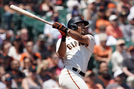 Jul 25, 2021; San Francisco, California, USA; San Francisco Giants right fielder LaMonte Wade Jr (31) hits a home run during the third inning against the Pittsburgh Pirates at Oracle Park. Mandatory Credit: Darren Yamashita-USA TODAY Sports
