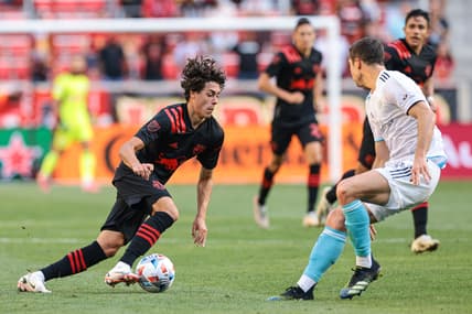 Jul 31, 2021; Harrison, New Jersey, USA; New York Red Bulls midfielder Caden Clark (37) controls the ball against New England Revolution midfielder Matt Polster (8) during the first half at Red Bull Arena. Mandatory Credit: Vincent Carchietta-USA TODAY Sports