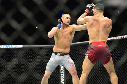 Oct 27, 2018; Moncton, Canada; Nordine Taleb (red gloves) fights Sean Strickland (blue gloves) during UFC Fight Night at Moncton Events Centre. Mandatory Credit: Trevor MacMillan-USA TODAY Sports