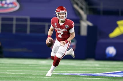 Dec 30, 2020; Arlington, TX, USA; Oklahoma Sooners quarterback Spencer Rattler (7) rolls out during the fourth quarter against the Florida Gators at ATT Stadium. Mandatory Credit: Tim Heitman-USA TODAY Sports