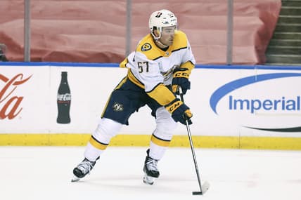 Mar 20, 2021; Sunrise, Florida, USA; Nashville Predators defenseman Dante Fabbro (57) skates with the puck against the Florida Panthers during the second period at BB&T Center. Mandatory Credit: Sam Navarro-USA TODAY Sports