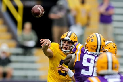 Apr 17, 2021; Baton Rouge, Louisiana, USA;  LSU Tigers quarterback Garrett Nussmeier (5) passes the ball against LSU Tigers defensive end Neil Farrell Jr. (92) during the second half of the annual Purple and White spring game at Tiger Stadium. Mandatory Credit: Stephen Lew-USA TODAY Sports