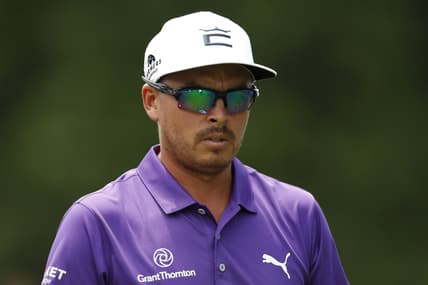 Jul 3, 2021; Detroit, Michigan, USA; Rickie Fowler walks off the 18th tee box during the third round of the Rocket Mortgage Classic golf tournament. Mandatory Credit: Raj Mehta-USA TODAY Sports