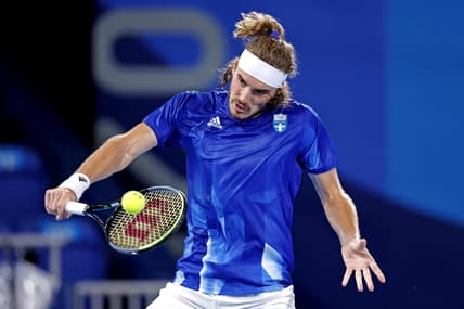 Jul 27, 2021; Tokyo, Japan; Stefanos Tsitsipas (GRE) plays Frances Tiafoe (USA) in the mens tennis first round singles during the Tokyo 2020 Olympic Summer Games at Ariake Tennis Park. Mandatory Credit: Yukihito Taguchi-USA TODAY Sports