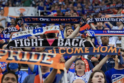 Jul 31, 2021; Cincinnati, OH, USA; Fans hold their scarfs in The Bailey during the national anthem prior to the game between D.C. United and FC Cincinnati in the first half at TQL Stadium. Mandatory Credit: Aaron Doster-USA TODAY Sports