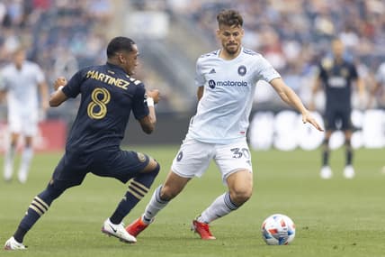 Aug 1, 2021; Chester, Pennsylvania, USA; Chicago Fire midfielder Gaston Gimenez (30) controls the ball against Philadelphia Union midfielder Jose Andres Martinez (8) in the first half at Subaru Park. Mandatory Credit: Mitchell Leff-USA TODAY Sports