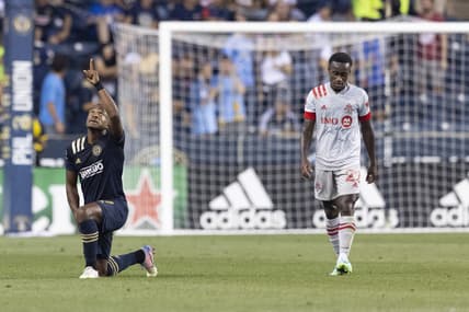 Aug 4, 2021; Chester, Pennsylvania, USA; Philadelphia Union forward Sergio Santos (17) reacts after scoring a goal as Toronto FC midfielder Richie Laryea (22) looks on in the first half at Subaru Park. Mandatory Credit: Mitchell Leff-USA TODAY Sports
