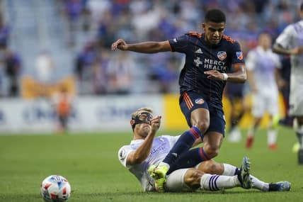 Aug 7, 2021; Cincinnati, OH, USA; FC Cincinnati forward Brenner (9) battles for the ball against Orlando City SC defender Robin Jansson (6) in the first half at TQL Stadium. Mandatory Credit: Katie Stratman-USA TODAY Sports