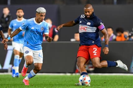 Aug 28, 2021; New York, New York, USA; New York City midfielder Santiago Rodriguez (42) defends against New England Revolution defender Andrew Farrell (2) during the first half  at Yankee Stadium. Mandatory Credit: Dennis Schneidler-USA TODAY Sports