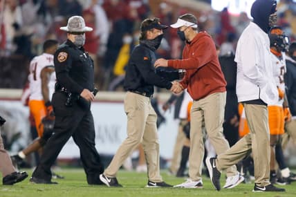 Oklahoma coach Lincoln Riley, right, greets Oklahoma State coach Mike Gundy after last year's Bedlam game in Norman.

cover