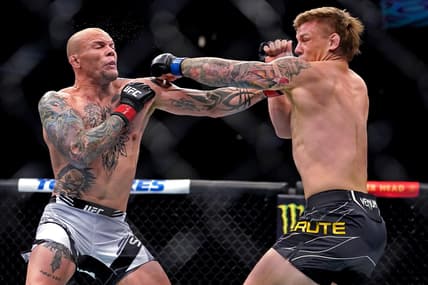 Apr 24, 2021; Jacksonville, Florida, USA; Anthony Smith (Red Gloves) fights Jimmy Crute (Blue Gloves) during UFC 261 at VyStar Veterans Memorial Arena. Mandatory Credit: Jasen Vinlove-USA TODAY Sports