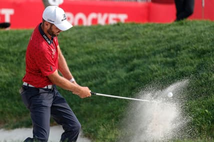 Troy Merritt hits out of 15th bunker during the second round of sudden death playoff of Rocket Mortgage Classic at the Detroit Golf Club in Detroit, Sunday, July 4, 2021.