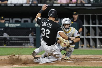 Sep 1, 2021; Chicago, Illinois, USA; Pittsburgh Pirates catcher Jacob Stallings (58) tags out Chicago White Sox first baseman Gavin Sheets (32) during the third inning at Guaranteed Rate Field. Mandatory Credit: Kamil Krzaczynski-USA TODAY Sports