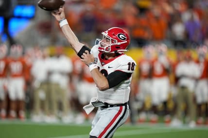 Sep 4, 2021; Charlotte, North Carolina, USA; Georgia Bulldogs quarterback JT Daniels (18) throws the ball against the Clemson Tigers during the second half at Bank of America Stadium. Mandatory Credit: Jim Dedmon-USA TODAY Sports