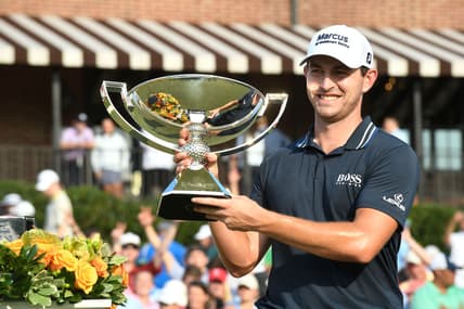 Sep 5, 2021; Atlanta, Georgia, USA; Patrick Cantlay holds up the trophy after winning the Tour Championship. Mandatory Credit: Adam Hagy-USA TODAY Sports