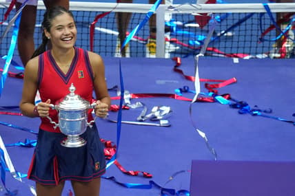 Sep 11, 2021; Flushing, NY, USA; Emma Raducanu of Great Britain celebrates with the championship trophy after her match against Leylah Fernandez of Canada (not pictured) in the women's singles final on day thirteen of the 2021 U.S. Open tennis tournament at USTA Billie Jean King National Tennis Center. Mandatory Credit: Danielle Parhizkaran-USA TODAY Sports