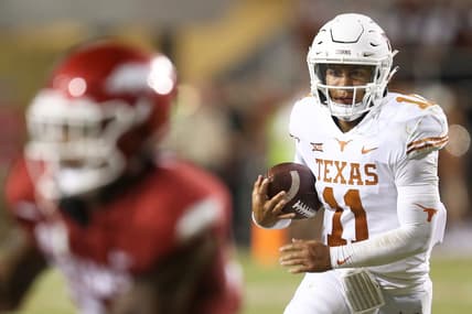 Sep 11, 2021; Fayetteville, Arkansas, USA; Texas Longhorns quarterback Casey Thompson (11) rushes in the second half against the Arkansas Razorbacks at Donald W. Reynolds Razorback Stadium. Arkansas won 40-21. Mandatory Credit: Nelson Chenault-USA TODAY Sports