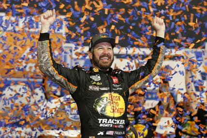 Sep 11, 2021; Richmond, Virginia, USA; NASCAR Cup Series driver Martin Truex Jr. (19) celebrates in victory lane after winning the Federated Auto Parts 400 Salute to First Responders at Richmond International Raceway. Mandatory Credit: Amber Searls-USA TODAY Sports
