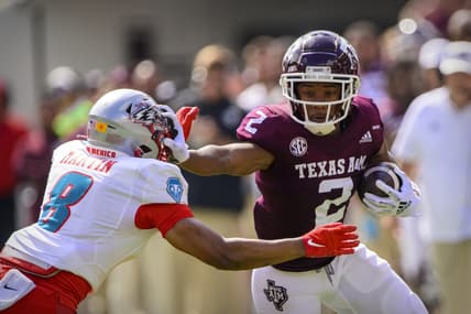 Sep 18, 2021; College Station, Texas, USA; Texas A&M Aggies wide receiver Chase Lane (2) stiff arms New Mexico Lobos cornerback Donte Martin (8) during the first half at Kyle Field. Mandatory Credit: Jerome Miron-USA TODAY Sports