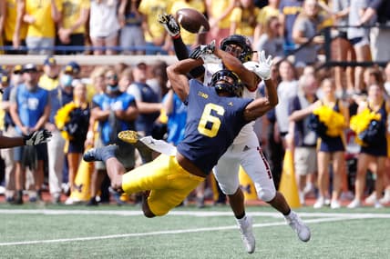 Sep 18, 2021; Ann Arbor, Michigan, USA;  Northern Illinois Huskies cornerback Jordan Gandy (14) breaks up a pass to Michigan Wolverines wide receiver Cornelius Johnson (6) in the first half at Michigan Stadium. Mandatory Credit: Rick Osentoski-USA TODAY Sports