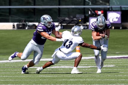 Sep 18, 2021; Manhattan, Kansas, USA; Nevada Wolf Pack defensive back Jordan Lee (13) tries to break away from the block by Kansas State Wildcats tight end Nick Lenners (87) to tackle Wildcats quarterback Will Howard (15) during the first quarter of a game at Bill Snyder Family Football Stadium. Mandatory Credit: Scott Sewell-USA TODAY Sports